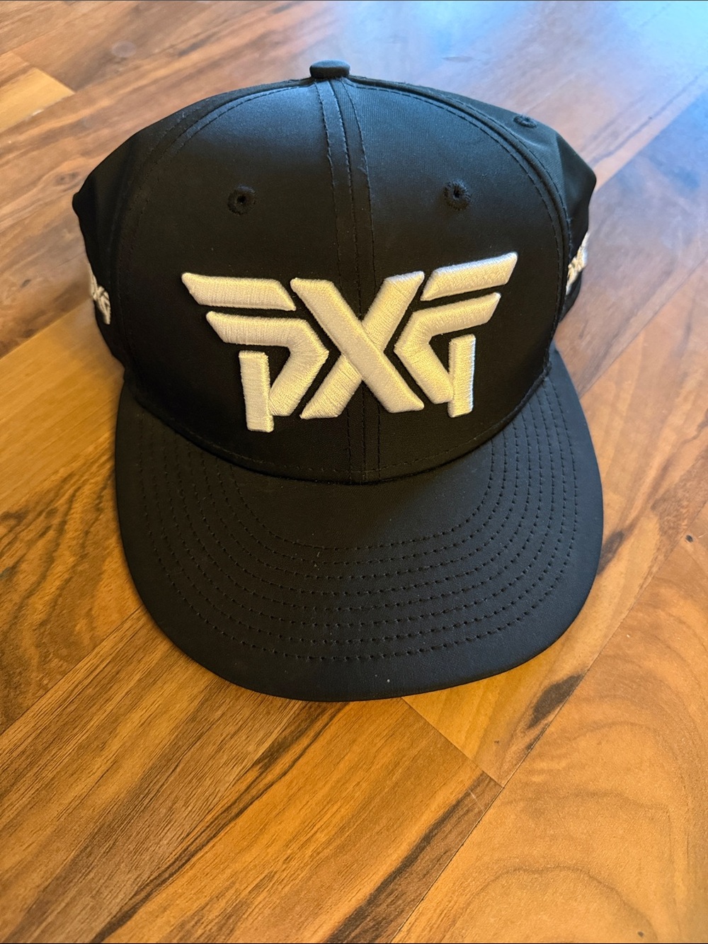 PXG Black Snapback Cap with White Embroidered Logo